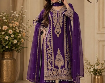 May include: A deep purple three-piece ensemble featuring a long-sleeved tunic with intricate gold embroidery, wide-leg trousers with matching gold hem detailing, and a sheer purple dupatta with delicate gold accents. The text ZS is visible.