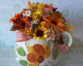 Colorful Floral Arrangement in a vintage hand painted ceramic pitcher