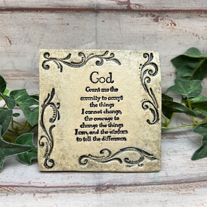 May include: A small, square, beige stone plaque with a decorative border and the text "God Grant me the serenity to accept the things I cannot change, the courage to change the things I can, and the wisdom to tell the difference."