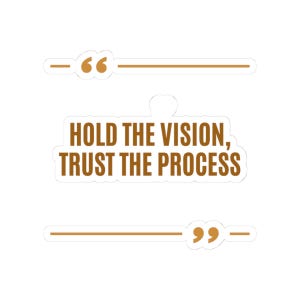 May include: A die-cut sticker featuring the brown text HOLD THE VISION, TRUST THE PROCESS. The design includes a brown opening quotation mark above the text and a brown closing quotation mark below the text, each flanked by horizontal lines.