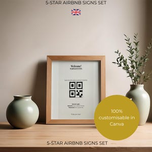 May include: A light wood frame containing a white sign with the text Welcome! So glad you're here, Scan the QR code to connect instantly, Manual Login: Network: [Your network name] Password: [Your password], and Enjoy your stay! A round vase and a tall vase with greenery are placed on either side.