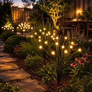 May include: A set of outdoor garden lights featuring multiple thin black metal stems topped with small, glowing warm white spherical bulbs. These decorative fixtures are arranged in clusters, resembling fireflies or glowing floral sprays.