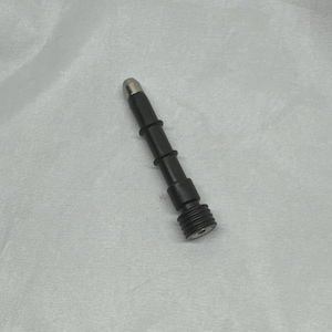 May include: A black and silver pen-like object with a cylindrical body. The top is silver, and the body has several segmented sections. The bottom has a ridged design. The object is on a white surface.