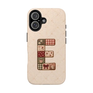 May include: A beige phone case with a quilted texture featuring a large letter E in the center. The letter is composed of various patchwork squares displaying patterns of red gingham, small floral prints, a steaming coffee cup, and a red bow.
