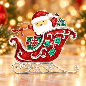 May include: A decorative metal brooch shaped like a Santa Claus figure sitting in a red glittery sleigh. The sleigh features silver scrollwork, green holly leaves, and red berries. A tan sack and a green gift box are tucked inside the sleigh.