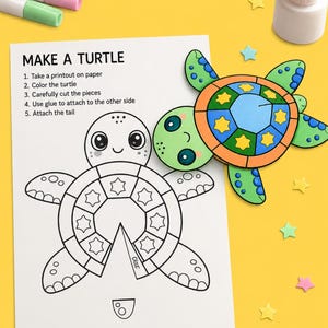 May include: A white paper sheet titled MAKE A TURTLE with instructions and a black and white turtle outline, alongside a fully colored turtle cutout, two markers, and a glue bottle. The paper features star and circle patterns on the turtle shell.