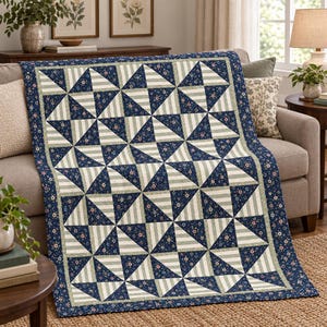 May include: A rectangular quilt featuring a repeating pattern of navy blue floral fabric squares alternating with light green and white striped squares. The quilt is finished with a solid navy blue border and a thin light green inner trim.
