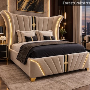 May include: A beige upholstered bed frame featuring a high, curved headboard with vertical channel tufting, integrated gold-toned LED lighting accents, and a central black vertical panel. The bed is dressed with a dark charcoal cover and pillows.