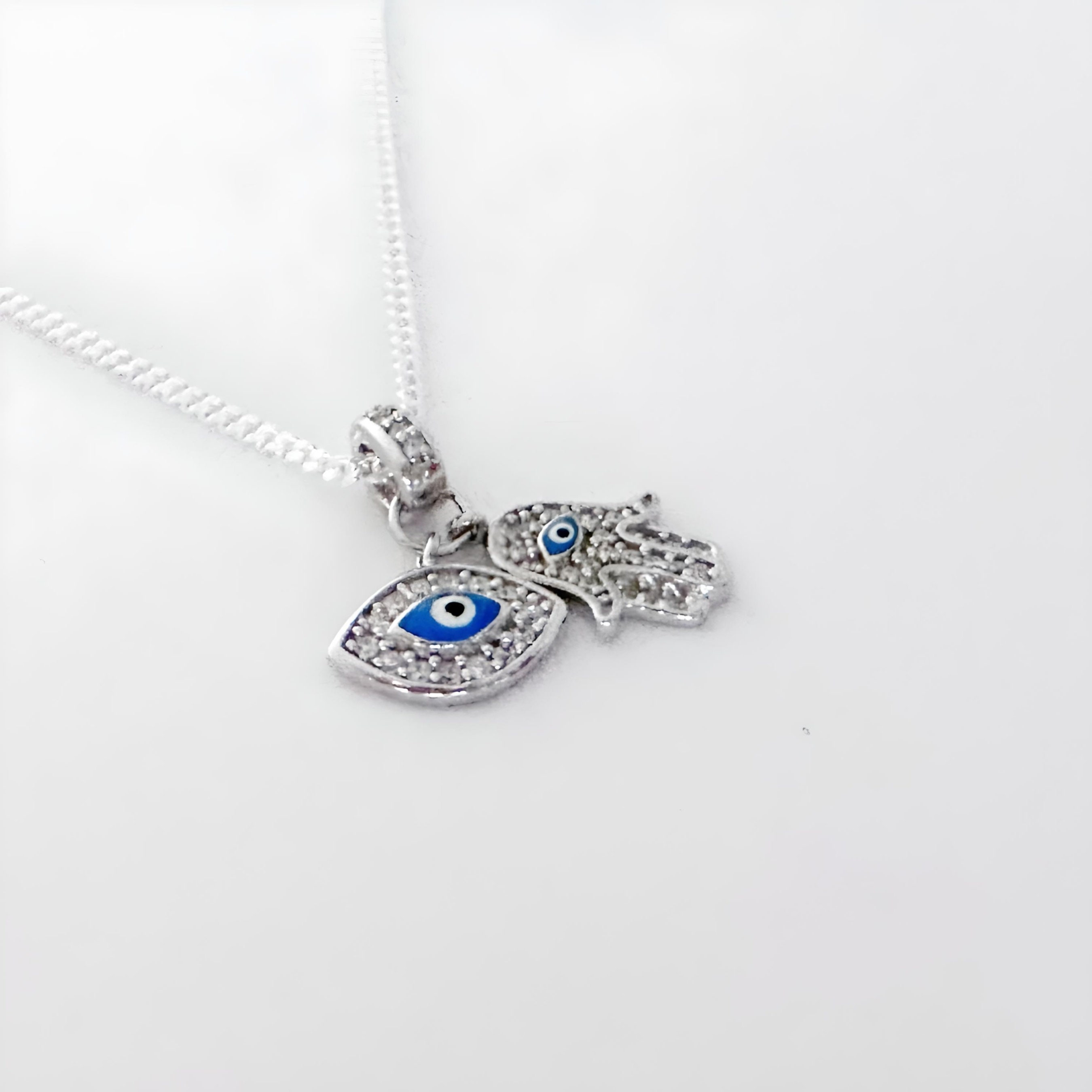 Collana Ciondolo Hamsa Malocchio In Argento 925 Con Zirconi Bianchi E Collana Ciondolo Hamsa Malocchio In Argento 925 Con Zirconi Bianchi E