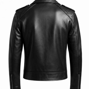 May include: A black leather jacket shown from the back, featuring a folded collar, quilted shoulder panels, and long sleeves with silver-toned metal zippers at the cuffs. The jacket has a smooth finish and a straight hemline at the bottom.