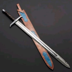 May include: A steel sword with a dark brown leather-wrapped handle and a straight crossguard. The blade features a central fuller. Beside the sword lies a tan leather scabbard with blue leather accents and a strap at the top for attachment.