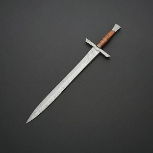 May include: A double-edged sword featuring a blade with a distinct wavy Damascus steel pattern. The hilt includes a straight metal crossguard and a grip wrapped in brown leather, finished with a metallic pommel at the end of the handle.