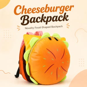 May include: A round backpack shaped like a cheeseburger with a golden-brown bun top, light green lettuce ruffles, and a brown base. The text Cheeseburger Backpack Novelty Food-Shaped Backpack is displayed above the item in brown lettering.