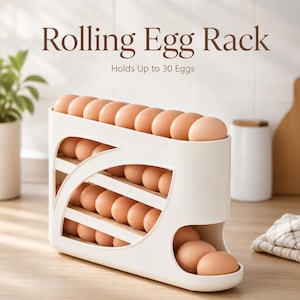 May include: A white plastic rolling egg rack with multiple slanted tiers, filled with brown eggs. The text Rolling Egg Rack and Holds Up to 30 Eggs is printed above the rack. The design features a curved side opening for dispensing eggs.