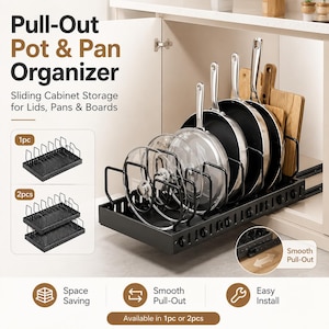 May include: A black metal pull-out pot and pan organiser with adjustable dividers, holding various lids, pans, and wooden cutting boards. The unit features a sliding track system for cabinet storage, with text labels including Pull-Out Pot & Pan Organiser.