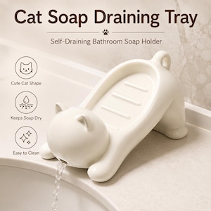 May include: A cream-colored cat-shaped soap draining tray with a self-draining design. The text reads Cat Soap Draining Tray, Self-Draining Bathroom Soap Holder, Cute Cat Shape, Keeps Soap Dry, and Easy to Clean. Water flows from the cat's mouth.