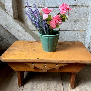 May include: A set of three ceramic mugs with a speckled, matte finish. The mugs are in shades of cream, light gray, and dark gray. Each mug has a simple, minimalist design and a rounded handle.