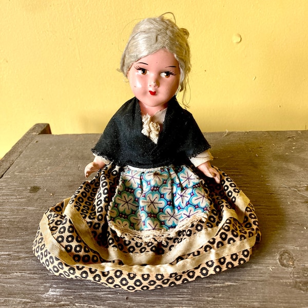 Small china doll grandmother doll 1900s 1920s painted face movable limbs cotton dress shaw