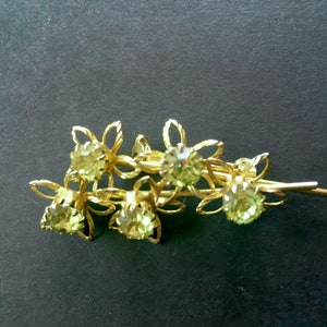 Light green rhinestone brooch - gold tone - floral and stems - 5 rhinestones - 2 stems - round faceted rhinestones