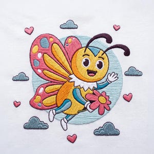 May include: An embroidered design on white fabric featuring a yellow and orange butterfly with pink wings, holding a pink flower. The butterfly is surrounded by small grey clouds and pink hearts against a light blue circular background.