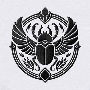 May include: A black embroidered design on a white fabric background featuring a central scarab beetle with outstretched wings, enclosed within a circular frame decorated with geometric shapes and stylized leaf motifs at the bottom.