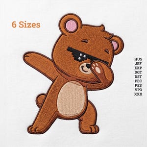 May include: An embroidery design of a brown bear dabbing while wearing black pixelated sunglasses. The bear has a light tan belly and pink inner ears. Text on the image includes 6 Sizes and file formats HUS, JEF, EXP, DGT, DST, PEC, PES, VP3, XXX.