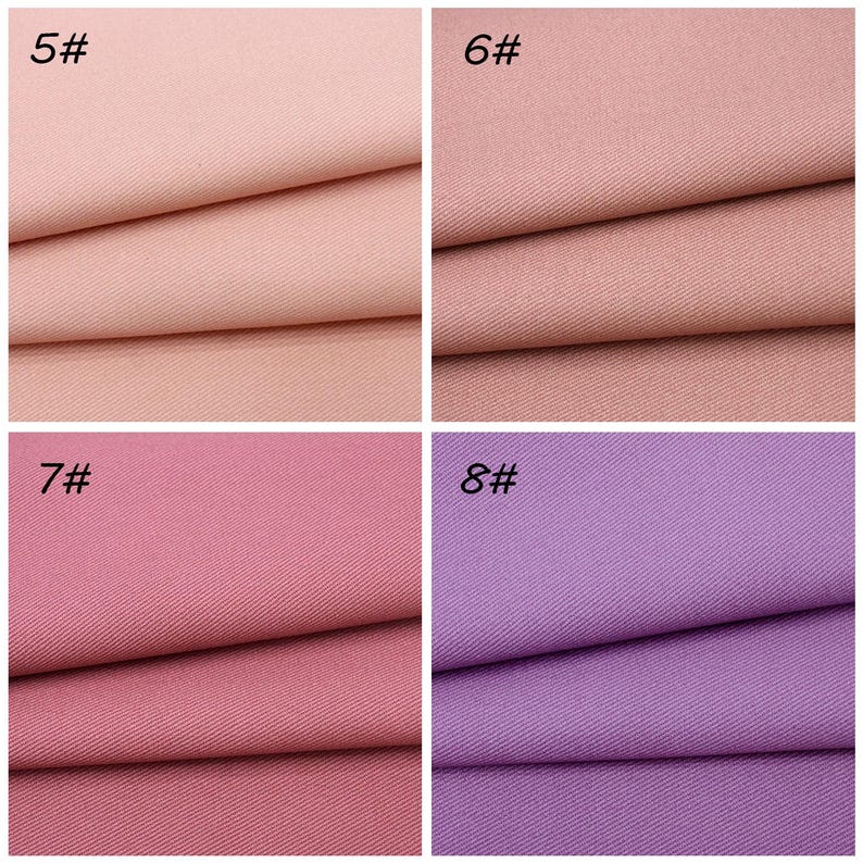 May include: A grid of four fabric swatches featuring a diagonal twill weave. The top left swatch is labeled 5# and is light pink. The top right swatch is labeled 6# and is dusty rose. The bottom left is 7# in mauve, and bottom right is 8# in lavender.