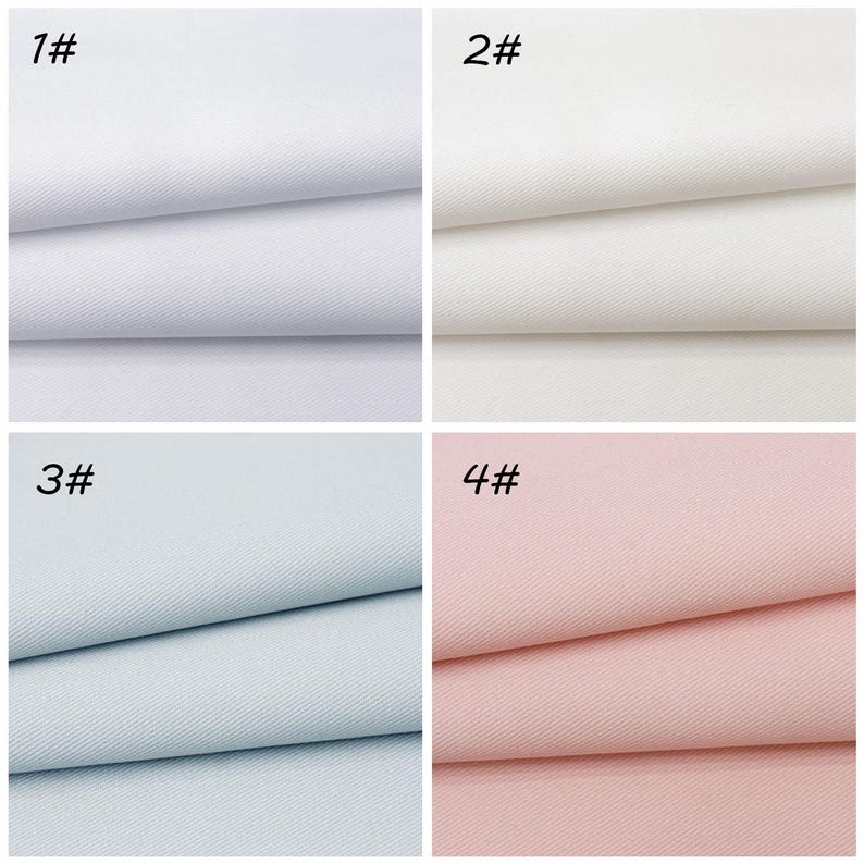 May include: A grid of four fabric swatches featuring a diagonal twill weave pattern. The top left swatch is bright white labeled 1#, the top right is off-white labeled 2#, the bottom left is light blue labeled 3#, and the bottom right is light pink labeled 4#.