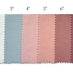 May include: A horizontal row of eight fabric swatches with a diagonal twill weave, each labeled with a number from 1# to 8#. The colors range from light blue, off-white, and sage green to various shades of pink, mauve, burgundy, and deep purple.