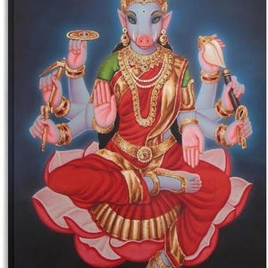 May include: A painting of Varaha, a deity with a blue boar head and human body, seated on a pink lotus. The figure wears a red and gold sari, ornate gold jewelry, and holds a discus, a conch shell, a mace, and a plow against a dark background.