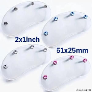 May include: Four clear, kidney-shaped acrylic pieces with metal and colored studs. Two pieces are labeled "2x1 inch", while the other two are labeled "51x25mm". The studs are silver, blue, and pink.