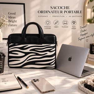 Peut inclure: Une sacoche pour ordinateur portable à motif zébré noir et blanc avec deux poignées supérieures et une poche frontale zippée. Le texte indique SACOCHE ORDINATEUR PORTABLE, ELEGANCE, PROTECTION, AU QUOTIDIEN, avec des icônes de protection.