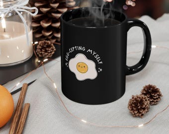 Egg-cepting Myself fried egg mug | Black ceramic mug