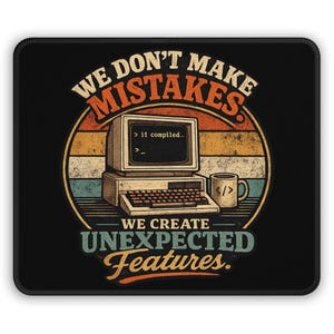 May include: A rectangular black mousepad featuring a vintage-style graphic of a beige computer and a coffee mug. The text reads: WE DON'T MAKE MISTAKES. it compiled.. WE CREATE UNEXPECTED FEATURES. The design uses a sunset-colored striped background.