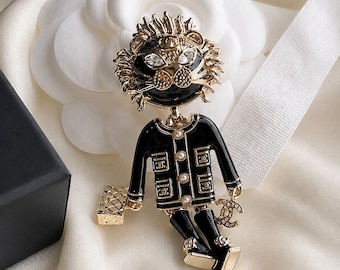 Vintage Chanel Gold-Tone Black Enamel Lion Doll Pearl Brooch with Bag