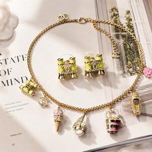 Vintage Chanel Gold-Tone Black Enamel Logo Necklace & CC Interlocking Earrings Set