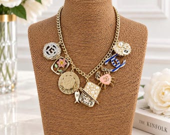 Vintage Chanel Gold Tone Multi Charm Necklace CC Logo Pearl Crystal Enamel Flower Crab Fish Hat Bag Statement Chain Necklace