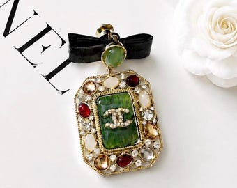 Vintage Chanel Gold-Tone Black Enamel Lion Doll Pearl Brooch with Bag