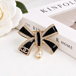 Vintage Chanel Black Enamel Crystal Bow Brooch with Pearl Drop Gold Tone Statement Pin