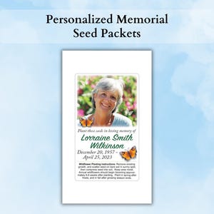 May include: A rectangular memorial seed packet featuring a photograph of a smiling person, two orange monarch butterflies, and the text: Plant these seeds in loving memory of Lorraine Smith Wilkinson, December 20, 1957 - April 25, 2023.