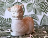 Cute little Avon quot Little Lamb quot Topaze Cologne. The Lamb is milk glass with a white plastic hear.