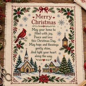 May include: A cross-stitch sampler on beige fabric featuring a red cardinal, a church, a house, and holly borders. The text reads: Merry Christmas, May your home be filled with joy, Peace and love this Christmas Day. May hope and blessings gently shine.