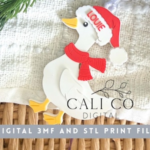May include: A white duck ornament featuring a red scarf and a red Santa hat with the name LOUIE printed on the brim. The duck has yellow feet and a yellow beak. The image includes the text CALI CO DIGITAL and DIGITAL 3MF AND STL PRINT FILE.