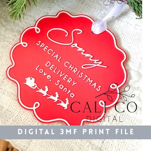 May include: A red, scalloped-edge Christmas ornament featuring white text that reads Sonny, SPECIAL CHRISTMAS DELIVERY, Love, Santa, and a graphic of a sleigh pulled by reindeer. A white ribbon is attached to the top for hanging.