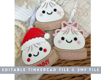 May include: Three white dumpling-shaped ornaments with smiling faces, each sitting on a tan base. One wears a red Santa hat, one has a pink bow, and one is plain. The bases feature the names Charlotte, Sloane, and Jonny in raised lettering.