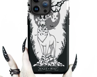 May include: Black and white phone case with a deer standing on a pile of skulls. The deer has a third eye and antlers. The background is a dark forest with a full moon. The text "ROGUE + WOLF" is printed on the bottom of the case.