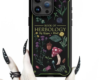 May include: Black phone case with a green border and a vintage book cover design. The cover features illustrations of plants and mushrooms with the text "BOOK OF HERBOLOGY By Rogue + Wolf".