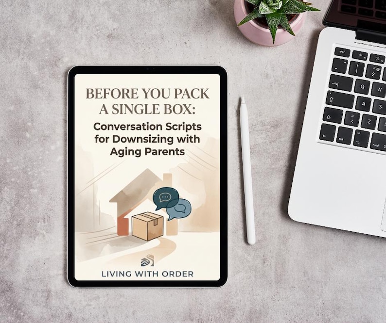 May include: A tablet screen displaying the title BEFORE YOU PACK A SINGLE BOX: Conversation Scripts for Downsizing with Aging Parents, featuring a brown cardboard box, a house outline, and two speech bubbles, with LIVING WITH ORDER at the bottom.