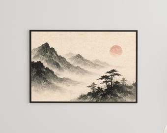 Puede incluir: Una impresión de arte mural enmarcada que presenta un paisaje pintado con tinta negra de montañas brumosas y pinos sobre un fondo beige texturizado, con un sol rojo circular y suave situado en la esquina superior derecha de la composición.