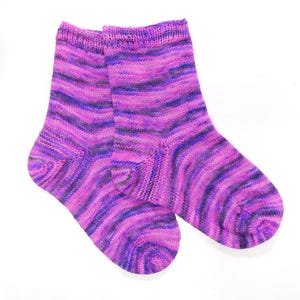 May include: A pair of purple and blue striped knitted socks. The socks are made of a soft, comfortable material and have a classic design.